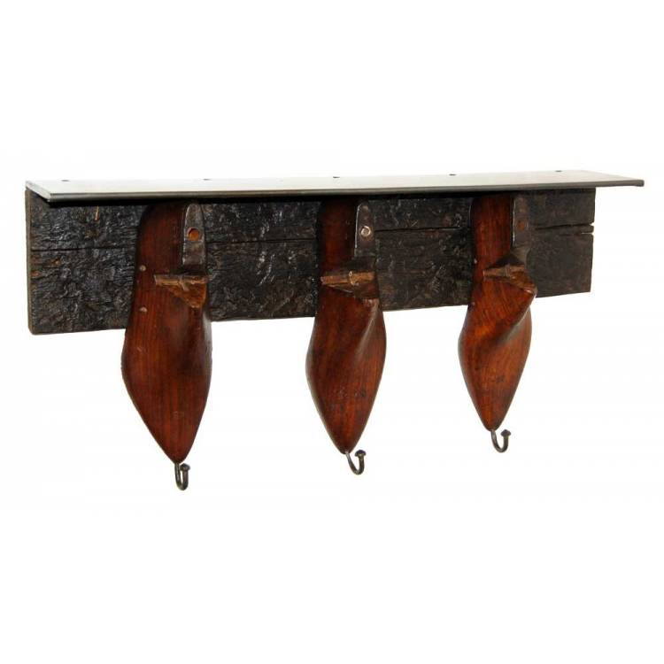 Old wooden shoe forms into hanger and shelf