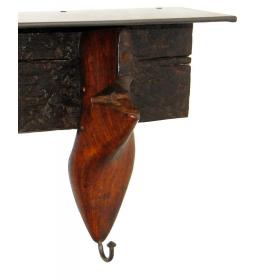 Old wooden shoe forms into hanger and shelf